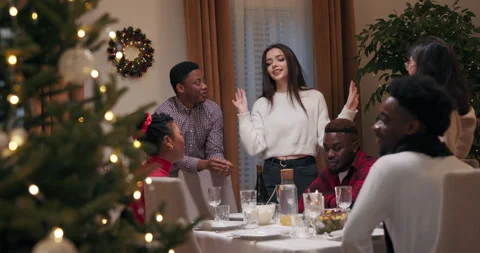 Students gathered at the table. They communicate, eat and drink. Girl with long Stock Footage 218263353