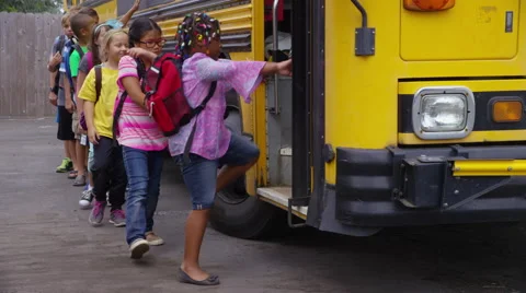 Students get onto school bus Stock Footage 68963880