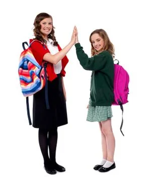 Students giving high five to each other Stock Photos