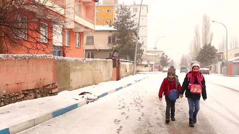 Students go to school while it snows in Erzurum, Turkey. kids have fun. Stock Footage 267278418