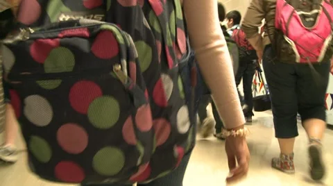 Students going through hallway with backpacks on. Video stock 8696857