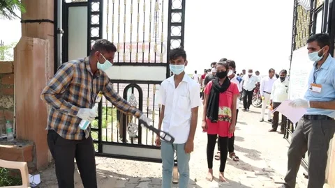 Students going through security check and sanitation process before entering Stock Footage 139379793