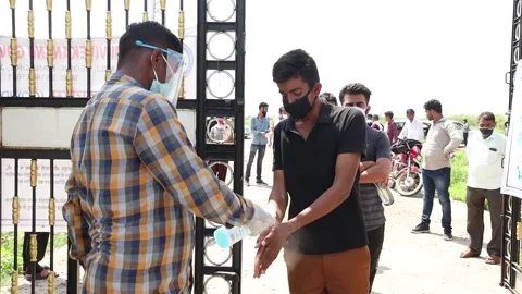 Students going through security check and sanitation process before entering Stock Footage 139379798