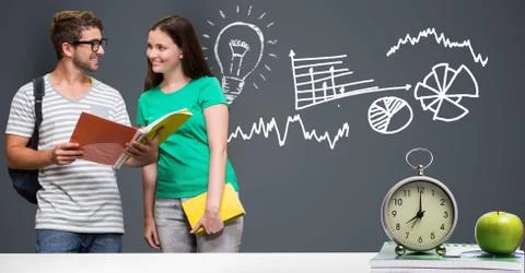 Students with graphics and table in front Foto stock