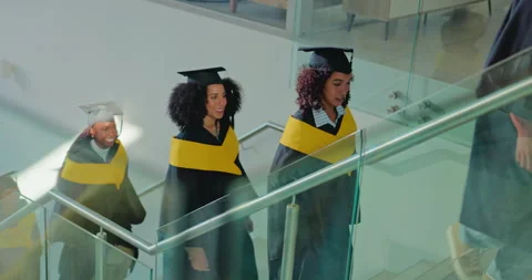 Students, group and happy on stairs for graduation, success or goal with Stock Footage 312251133