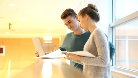 Students in hall connected with laptop Stock-Footage 86464306