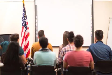 Students in hall sitting back view Foto stock