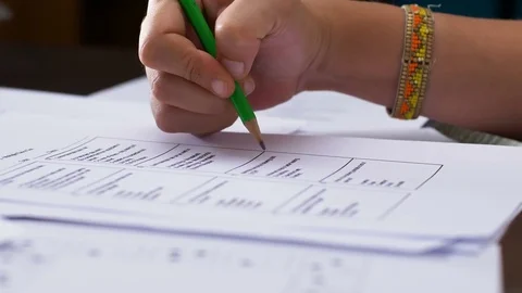 Student's hand analyizing multiple choice test Stock Footage 78212647
