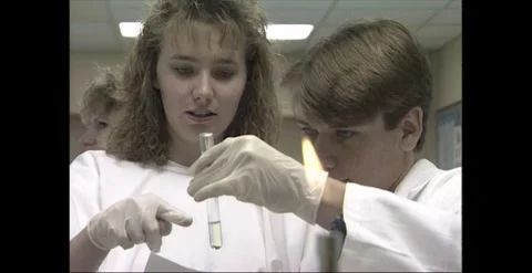 Students Handling Test Tube During Science Experiment 1998 Stock Footage 318276128