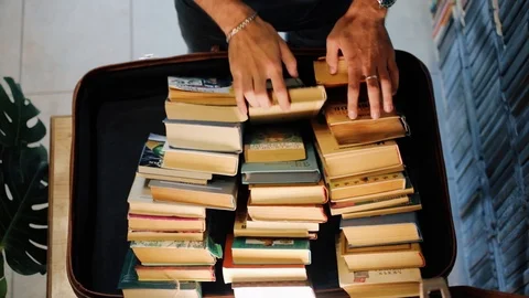 Student's hands looking for book in case Stock Footage 118213960