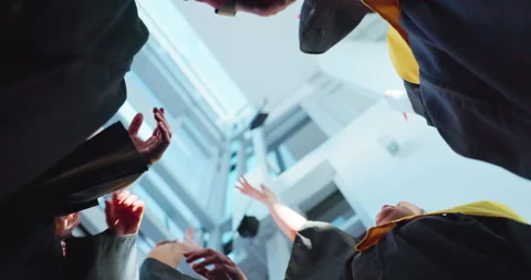 Students, happy and throw hats for graduation, celebration and success with Stock Footage 312377441