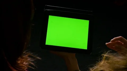 Students having a debate and holding an tablet pc with green screen Stock Footage 74356777