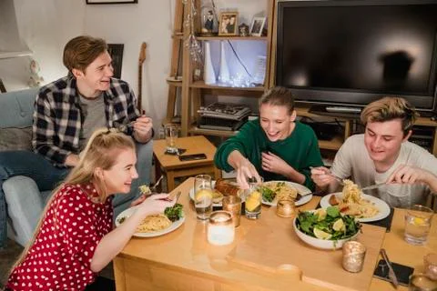 Students Having a Dinner Party Fotos Stock