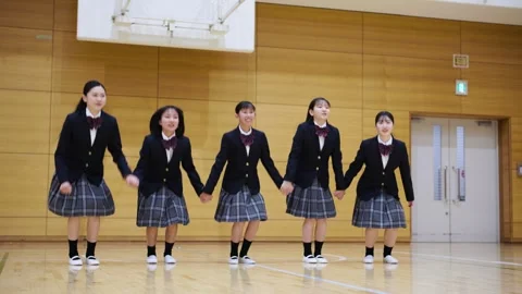 Students Jumping While Holding Hands Vidéo 332750709