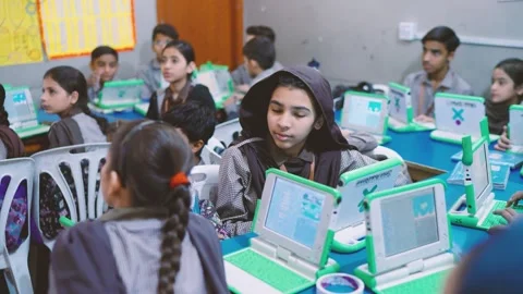 Students in a Karachi school learning coding and digital skills using laptop Stock Footage 330873152