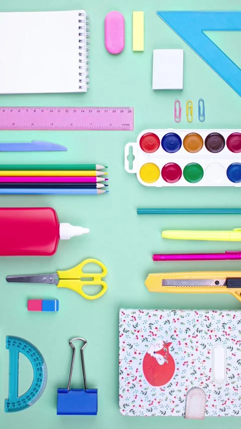 A student's kit. The layout of school supplies on the table, frame of supplies Stock Footage 281759857