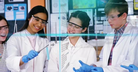 Students at lab bench, one student showing tweezers demo for learning while code Video stock 331197652