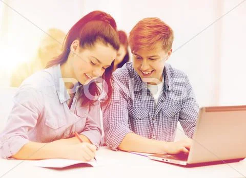 Students with laptop and notebooks at school Stock Photos