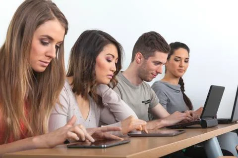 Students with laptops and tablets Stock Photos