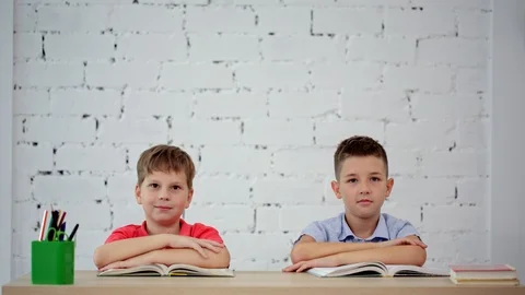 Students laugh at the desk in class Stock Footage 92070988