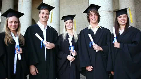 Students laughing while holding their diplomas Stock Footage