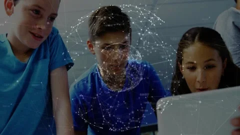 Students leaning over tablet in classroom, touching screen and viewing Stockbeeldmateriaal 331269937