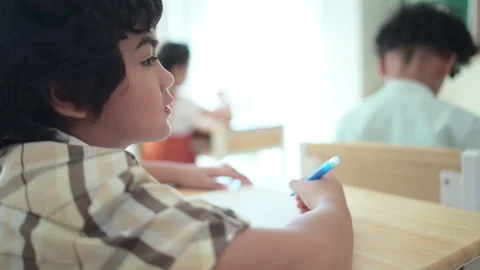 Students learn and study in a classroom of school where youngsters sit and play Stock Footage 282781090