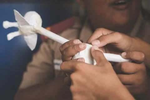 Students learn to make paper mache art as a giraffe in school. Stock Photos