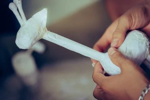 Students learn to make paper mache art as a giraffe in school. Stock Photos