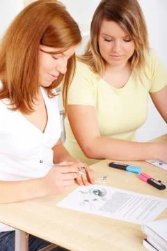 Students learning at desk Stock Photos