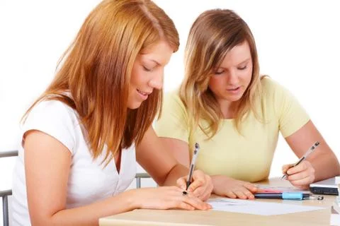 Students learning at desk Stock Photos
