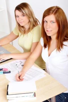 Students learning at desk Stock Photos