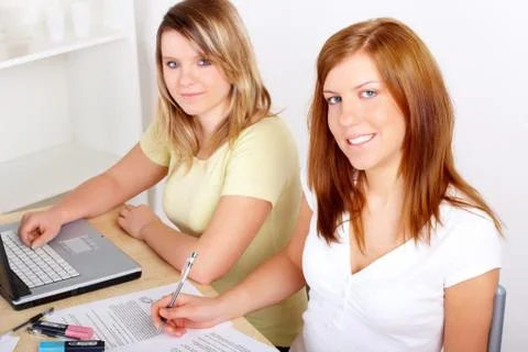 Students learning at desk Stock Photos