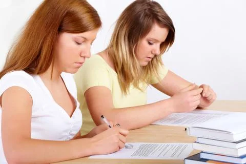Students learning at desk Stock Photos