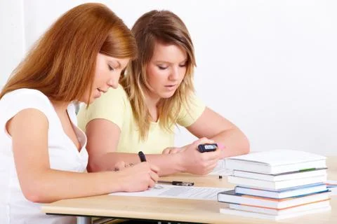 Students learning at desk Stock Photos