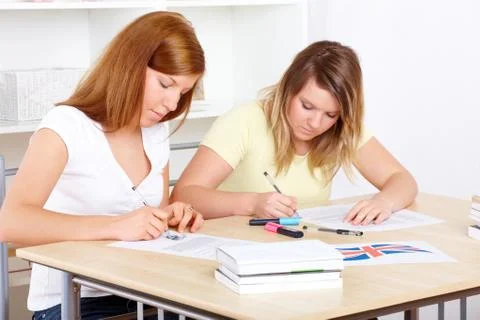 Students learning at desk Stock Photos