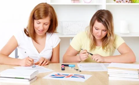 Students learning at desk Stock Photos