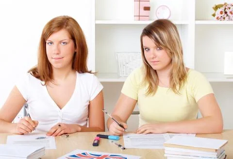 Students learning at desk Stock Photos