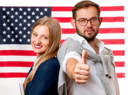 Students is learning English as a foreign language. Man and woman on American 写真素材