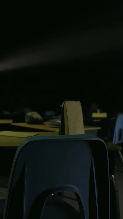 Students leave bags on chairs in an empty classroom during the afternoon Stock Footage 334174537