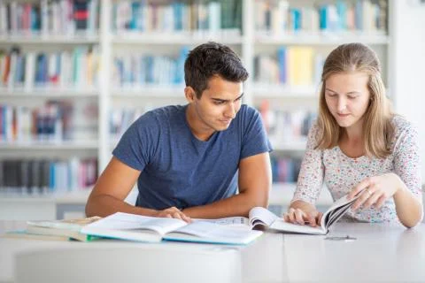Students in a library, studying for an exam Stock Photos