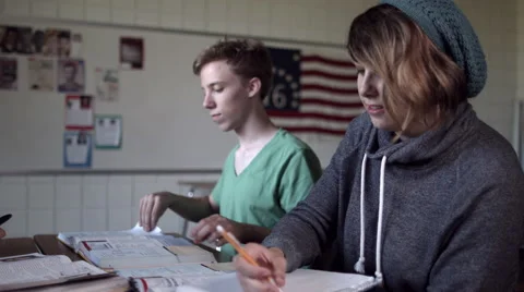 Students look up assignment in class discussion 4K Stock Footage 41178849