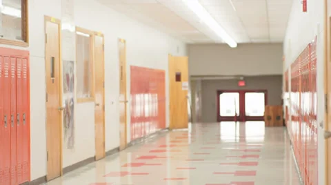 Students open classroom doors and stream into the empty hallway Video stock 33891768