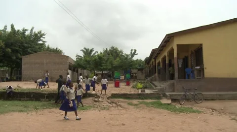STUDENTS OUTSIDE OF SCHOOL- PAN TO SANITATION FACILITY Stock Footage 60116073