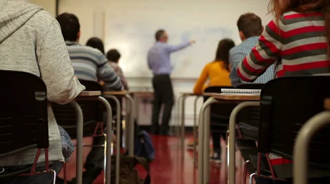 Students passing notes in class Stock Footage 32880589