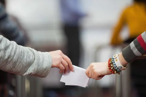 Students passing notes in classroom Photos
