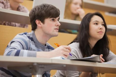Students paying attention while sitting in a lecture hall Stock Photos