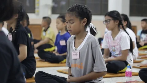 Students of Pieamsuwan school in Buddhist Camp, Students are praying Stock Footage 76907046