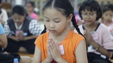 Students of Pieamsuwan school in Buddhist Camp, Students are praying Stock-Footage 76909369