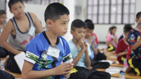 Students of Pieamsuwan school in Buddhist Camp, Students are praying Stock Footage 76909454